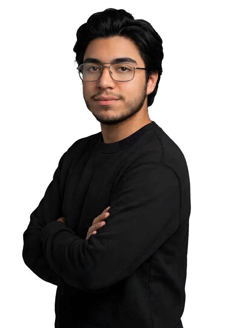 Portrait of Jesús (Dørabæ) in glasses and a black sweatshirt, arms crossed